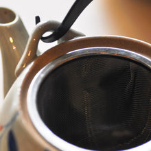 Load image into Gallery viewer, a close up of a hand-painted ceramic teapot