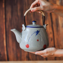 Load image into Gallery viewer, a close up of a hand-painted ceramic teapot