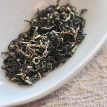 Load image into Gallery viewer, a close up of early spring bi luo chun green tea dry tea leaves

