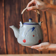 将图片加载到图库查看器，a close up of a hand-painted ceramic teapot

