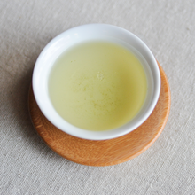Load image into Gallery viewer, a cup of a tea king tie guan yin
